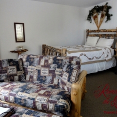 Our room at Fawn Valley Inn - Mountains, fishing and bears decor, nicely done with a small kitchen.