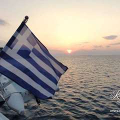 Greek flag at sunset