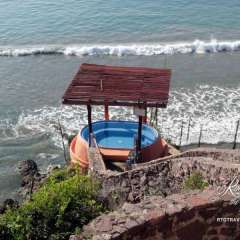 One of two cliffside hot tubs