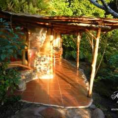 Vanira Lodge. This is the ocean facing side and the roof on the rest is covered in flowers and greens!